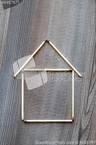 Image of simple house of match sticks