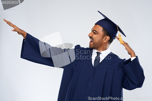 Image of happy indian graduate student celebrating success