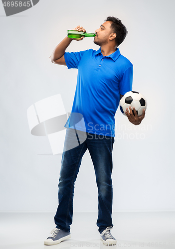 Image of indian male football fan with soccer ball and beer