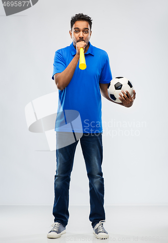 Image of male football fan with soccer ball and vuvuzela