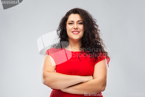 Image of happy confident woman in red with crossed arms