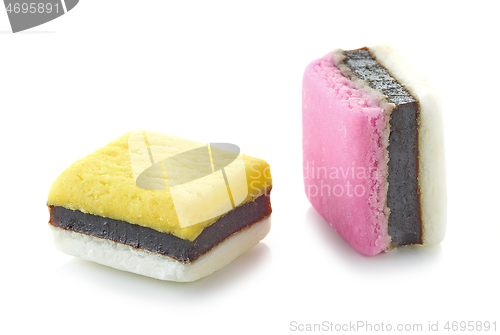 Image of two pink and yellow candies with licorice