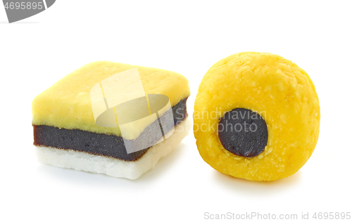 Image of two yellow candies with licorice