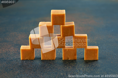 Image of caramel candies on dark background