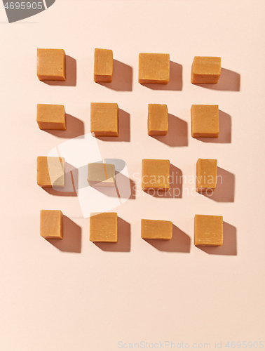 Image of flat lay composition of caramel candies