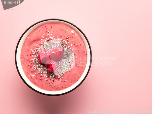 Image of breakfast smoothie bowl on pink background