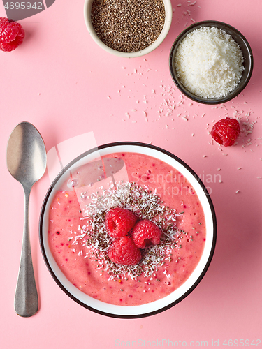 Image of breakfast smoothie bowl on pink background