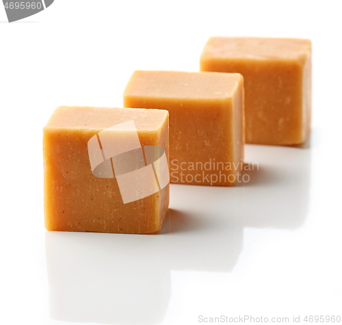 Image of caramel candies on a white background