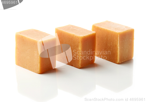 Image of caramel candies on a white background