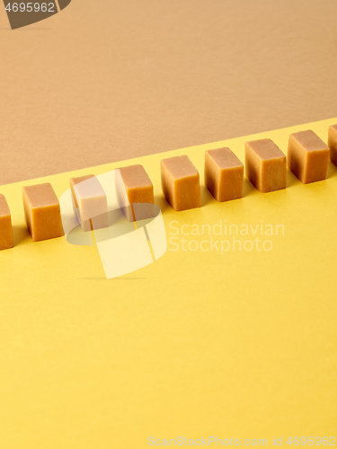 Image of line of caramel candies