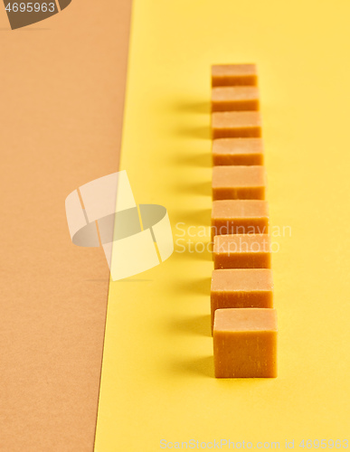 Image of line of caramel candies