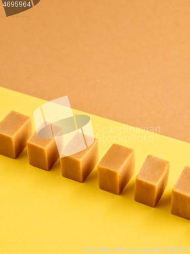 Image of line of caramel candies