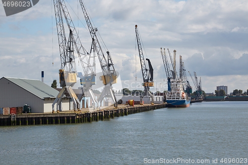 Image of Industrial ships in dock with rotterdam city view