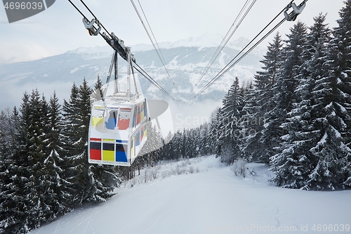 Image of Skiing lift cabin over a valley