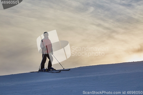 Image of Skier against glowing sky