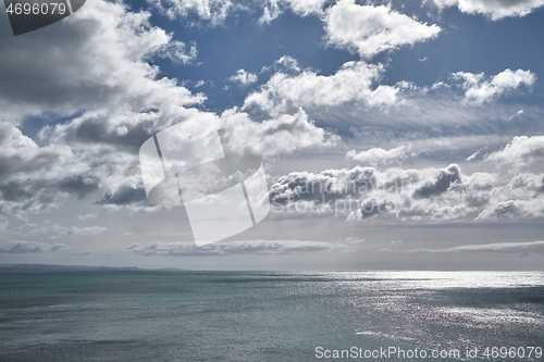 Image of Endless sea view, bright sunlight and clouds