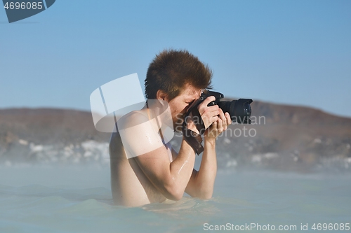 Image of Enjoying hot spring spa, taking picures