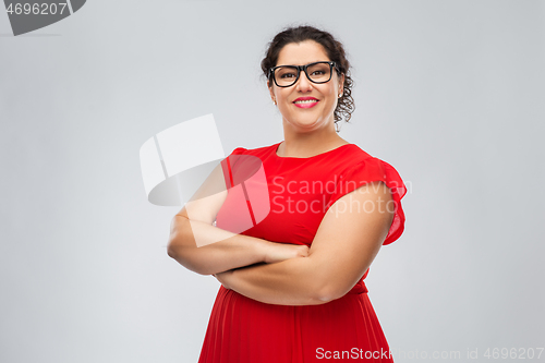 Image of happy woman in glasses with crossed arms