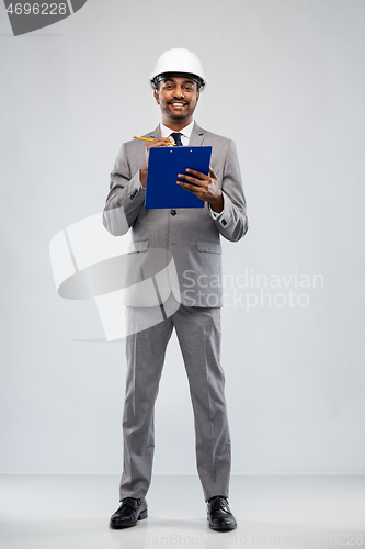 Image of indian male architect in helmet with clipboard