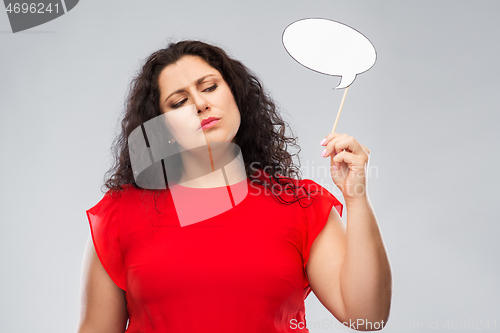 Image of unhappy woman in red dress holding speech bubble