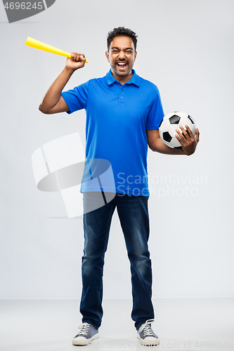 Image of male football fan with soccer ball and vuvuzela