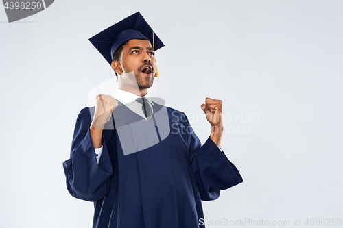 Image of happy indian graduate student celebrating success