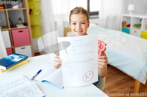 Image of student girl with school test good mark at home