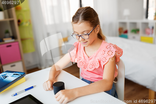 Image of student girl using smart speaker at home