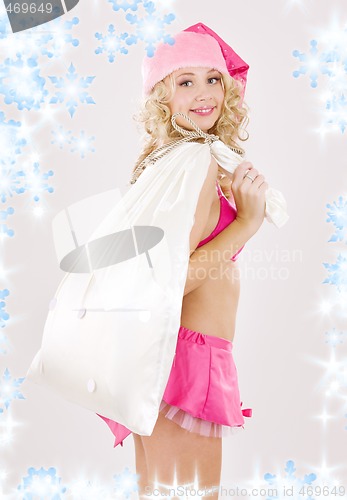 Image of cheerful santa helper girl with big bag