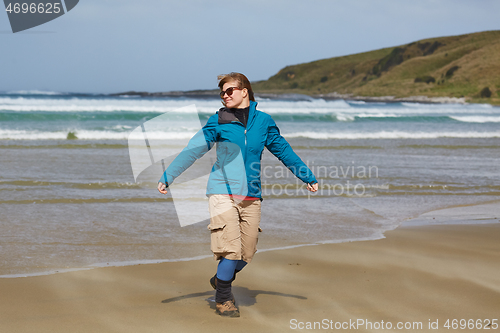 Image of Womane injoying seaside wind