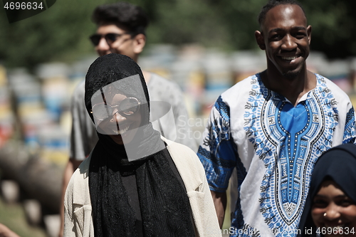 Image of people group visiting local honey production farm