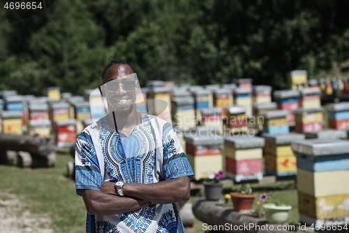 Image of african beekeeper local black honey producer