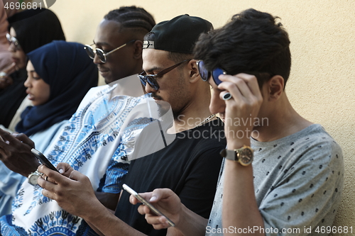 Image of multiethnic startup business people group using smart phones