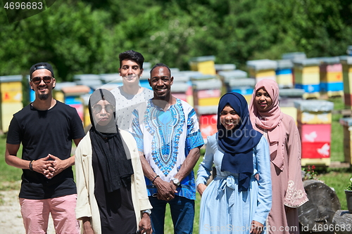 Image of people group visiting local honey production farm