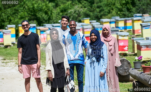 Image of people group visiting local honey production farm