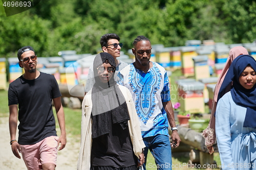 Image of people group visiting local honey production farm