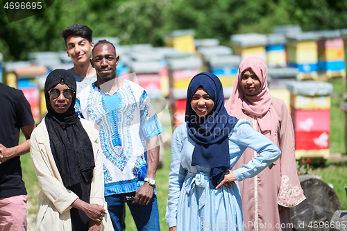 Image of people group visiting local honey production farm