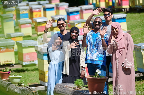 Image of people group visiting local honey production farm