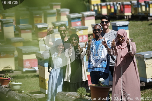 Image of people group visiting local honey production farm