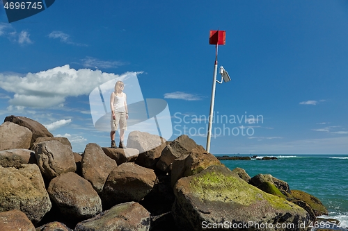 Image of Woman enjoying seaside view