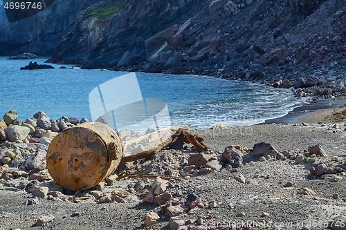 Image of Old rusty boiler scrap metal on the shore