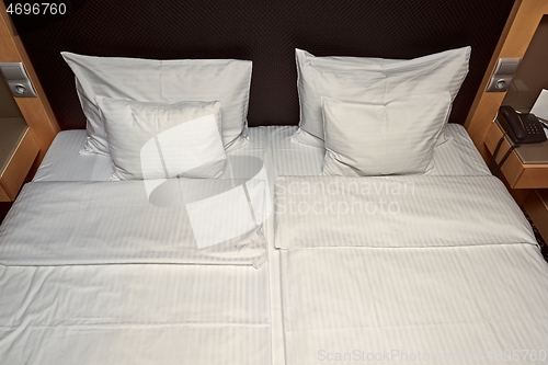 Image of Hotel bed with white sheets