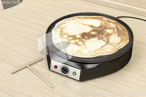 Image of Electric pancake maker in the kitchen