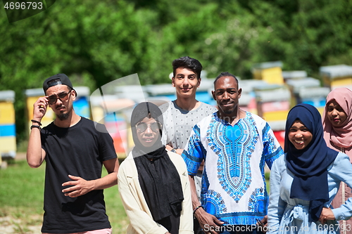 Image of people group visiting local honey production farm