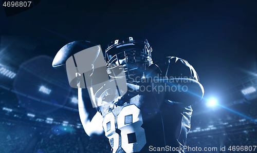 Image of american football player throwing rugby ball