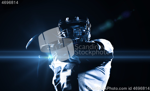 Image of american football player throwing rugby ball