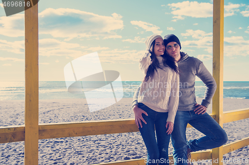 Image of Couple chating and having fun at beach bar