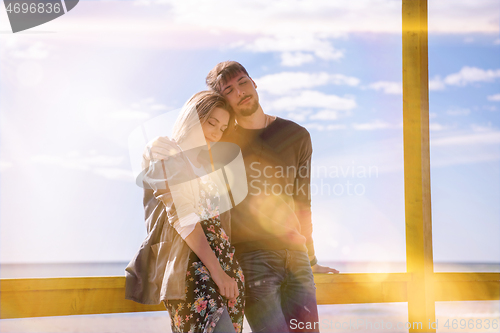 Image of Couple chating and having fun at beach bar