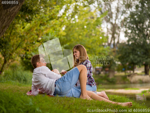 Image of Couple in love enjoying picnic time