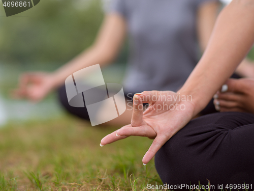 Image of women meditating and doing yoga exercise